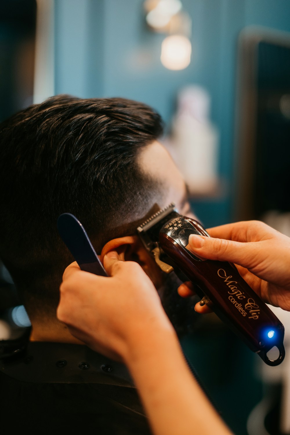 Barber working on a client's beard